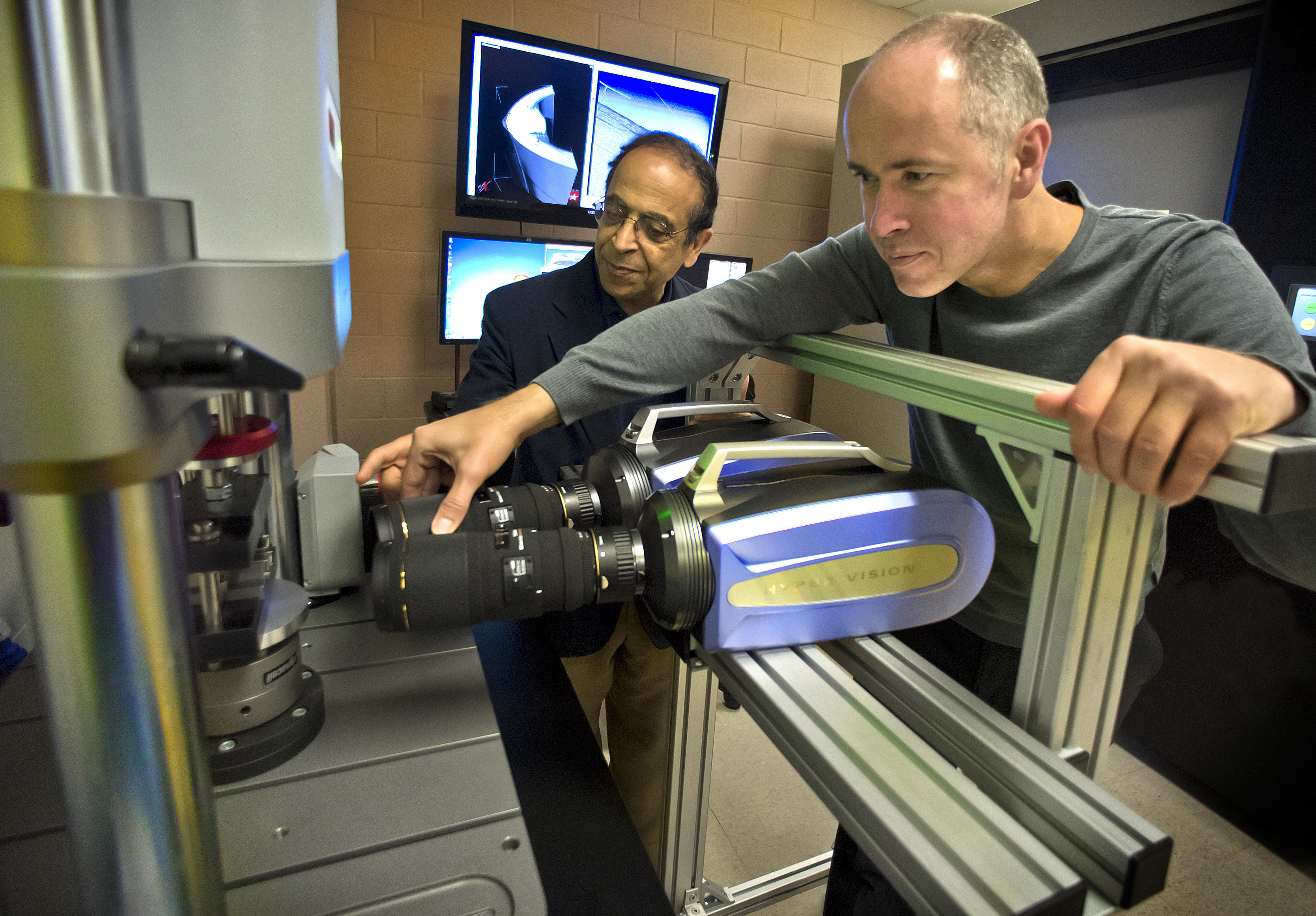 Andrew Makeev, right, professor in the mechanical and aerospace engineering department and director of the UT Arlington Advanced Materials and Structures Lab, looks over research results with Erian Armanios, chair of the mechanical and aerospace engineering department.