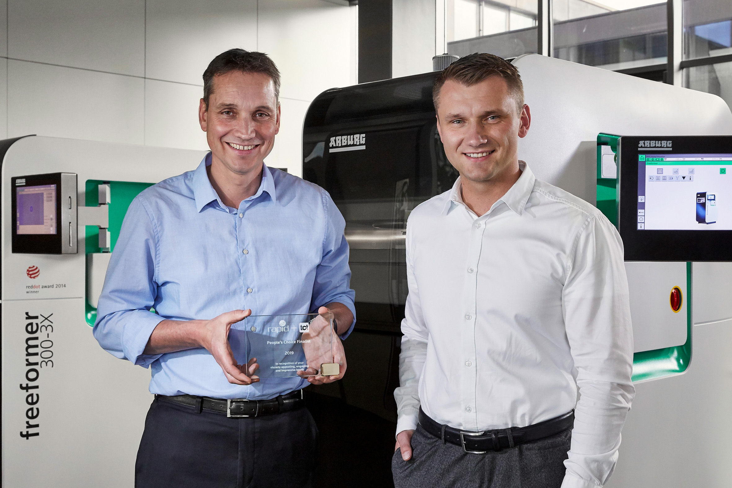 Lukas Pawelczyk, head of Freeformer sales (right), and Martin Neff, head of plastic freeforming. (Photo courtesy Arburg.)