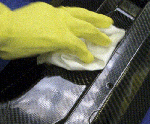 Release agent being wipe-applied to a carbon/epoxy composite mould. The release agent in this case is Marbocote TRE 45ECO, an aerospace-approved solvent-based SPMRA.