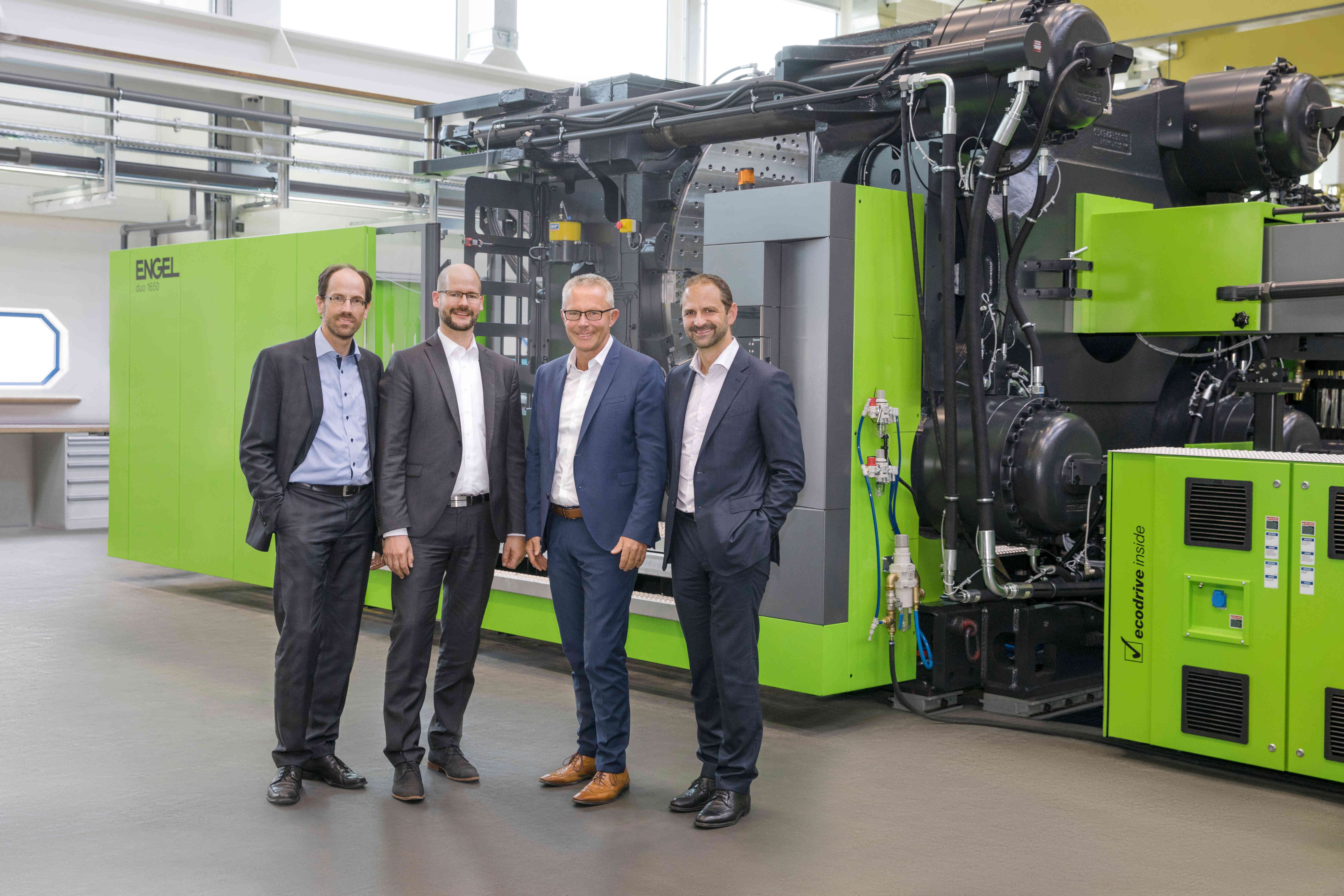 From left to right: Dr Norbert Müller, head of the Engel Technology Centre for Lightweight Composites, Dr Michael Emonts, managing director of the Aachen Center, Rolf Saß, general manager of Engel Deutschland GmbH and Dr Christoph Steger chief sales officer at Engel Holding. (Photo courtesy Engel Austria.)