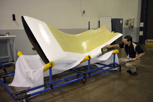 A Northrop Grumman engineer inspects the first F-35 production air inlet duct delivered by Turkish Aerospace Industries.