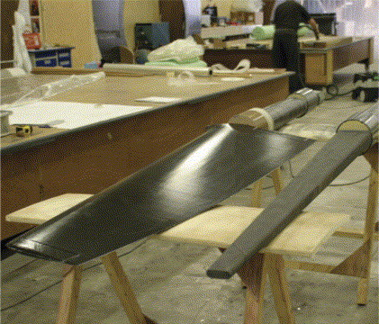 Manufacturing the twin carbon rudders. A rudder stock is seen on the right and a full blade to the left. (Picture courtesy of Killian Bushe and Andrew Lowe.)