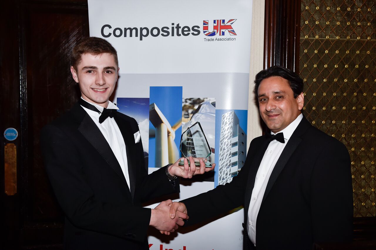 Rodney Hansen, MD of Dark Matter Composites, presents James Kilbane with the Apprentice of the Year Award.