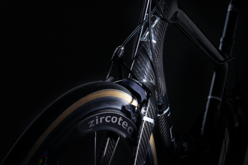 A Zircotec coating is applied to the rims of carbon composite bicycle wheels to provide a tough, long lasting and durable braking surface.