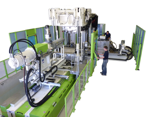 NMB's combined compression and injection moulding machine.