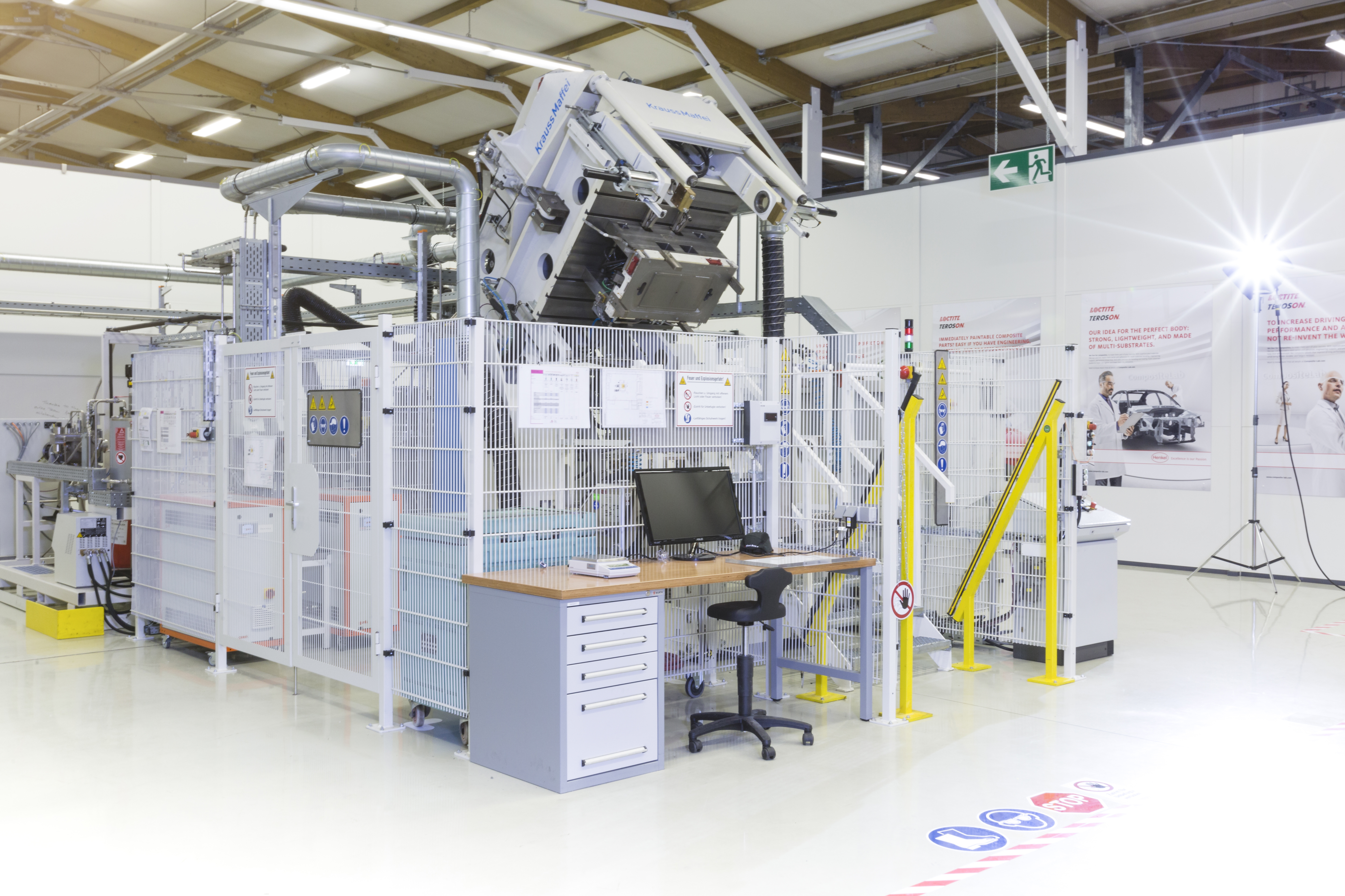 Henkel’s HP-RTM equipment, located at Henkel’s Composite Lab in Heidelberg (Germany), has resin injection units for polyurethanes and epoxies coupled to a 380-tonne press. (Photo courtesy Henkel.)