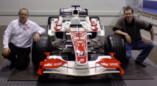 Ian Thomson (left) and Rob Neumann with the Super Aguri F1 car on which they worked together, completing chassis modifications for new engine and design and testing of all new crash structures.