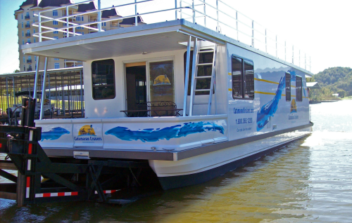 A 14 ft by 40 ft (4.3 m by 12.2 m) Catamaran Cruiser is launched into service.