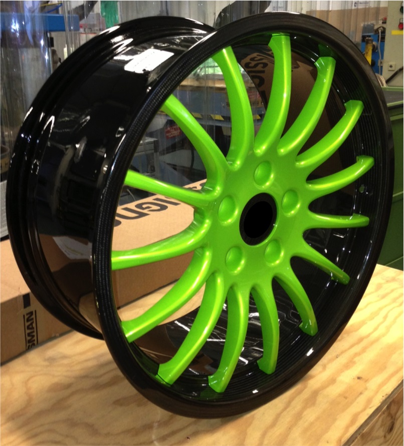 The wheel features an Araldite structural system carbon fibre reinforced polymer (CFRP) rim around an aluminum alloy centre star.