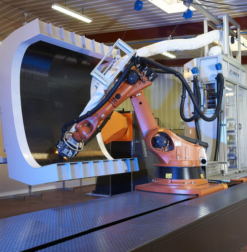 Multi-axis articulating robotic machines like this, currently being developed for manufacturing operations, could be adapted for automated repair use. (Picture courtesy of Coriolis Composites.)