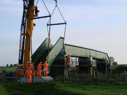 Installing the composite bridge steps. (Picture courtesy of Birse Rail/AM Structures.)