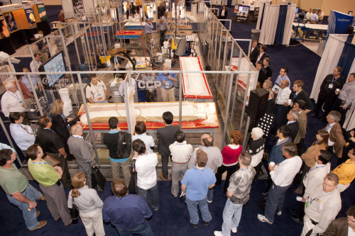 Demonstrations on the exhibit hall floor, like this one by Cook Composites & Polymers at a previous show, will be a highlight of Composites 2011. (Picture courtesy of ACMA.)