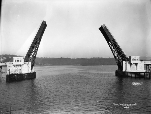 A bascule bridge example is the Lewis and Clark River bridge in Oregon. It is a single-leaf bascule-type drawbridge built in 1924. It was rehabilitated in 2002 with a new FRP deck, operating machinery, machinery house restoration, bridge rail retrofit, and repairs to the approach (see below).