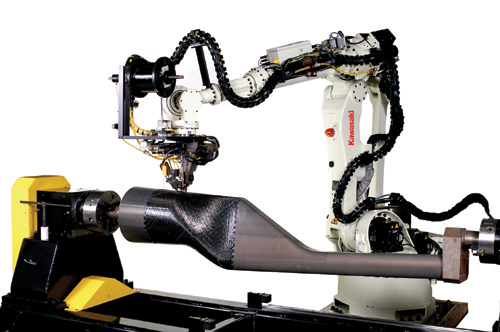 Automated Dynamics’ XT series fibre placement robot  processing unidirectional carbon fibre/PEEK thermoplastic prepreg during the production of a helicopter tailboom. Such robotic AFP processing 'heads' can fabricate with either thermoset or thermoplastic materials. (Picture courtesy of Automated Dynamics.)