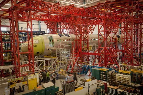 The test airframe - comprised of both metallic and composite structures - is being fitted and assembled in a test rig consisting of a superstructure of steel towers and trusses, as well as loading structures and loading actuators that will be used to apply loads to the test airframe.