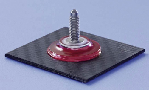 The ONSERT threaded bolt with plastic base and adhesive (red) on a CFRP plate. (Picture courtesy of Böllhoff.)