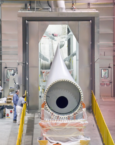 A wind turbine blade positioned in the automated paint facility in an MFG blade manufacturing facility. (Picture courtesy of MFG.)