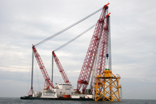 Using a heavy duty crane, the foundations were placed on top of pre-installed piles on the seabed and attached to them.