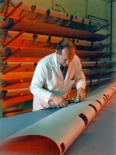 A Hamble technician working on a composite part of a wing leading edge.