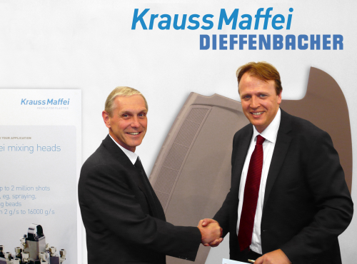 Dr Günter Kuhn (left), Managing Director and CTO of the Dieffenbacher Group, and Frank Peters (right), member of the Board of Management of KraussMaffei, confirm their collaboration on high pressure RTM systems.