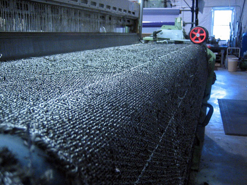 Pepin Associates has introduced a carbon fibre grade of its Disco-Tex formable fabric, shown here being woven.