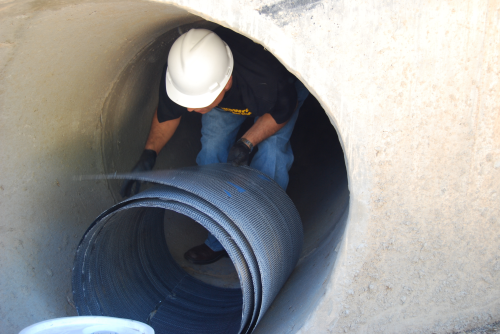 Figure 3a: Coiled PipeMedic laminate being taken into a pipe.