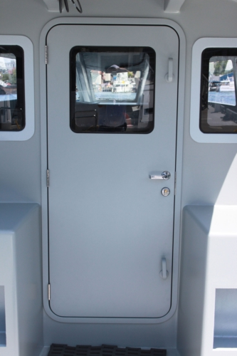 Zyvex Marine and Pacific Coast Marine say their nano-enhanced lightweight door weighs 66% less than traditional marine doors. (Picture courtesy of PRNewsFoto/Zyvex Marine.)