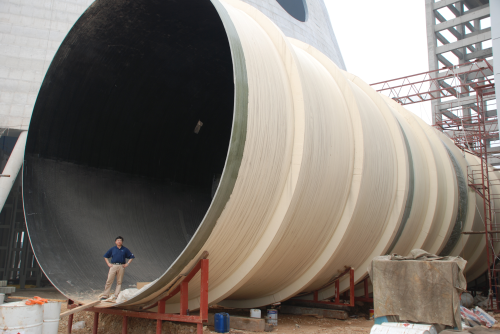 Henry Tong, General Manager of Syrgis China, inside an 8.5 m diameter composite pipe.