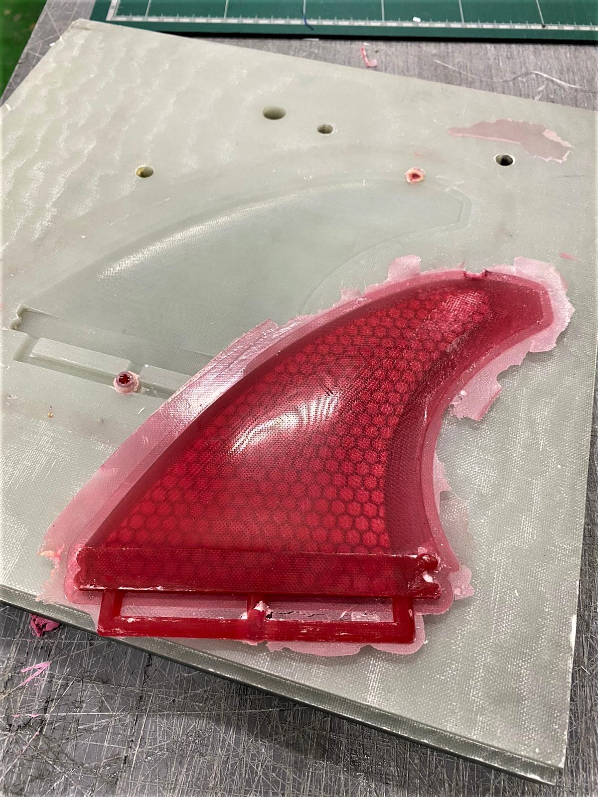 A mold and fin made with recycleable epoxy.