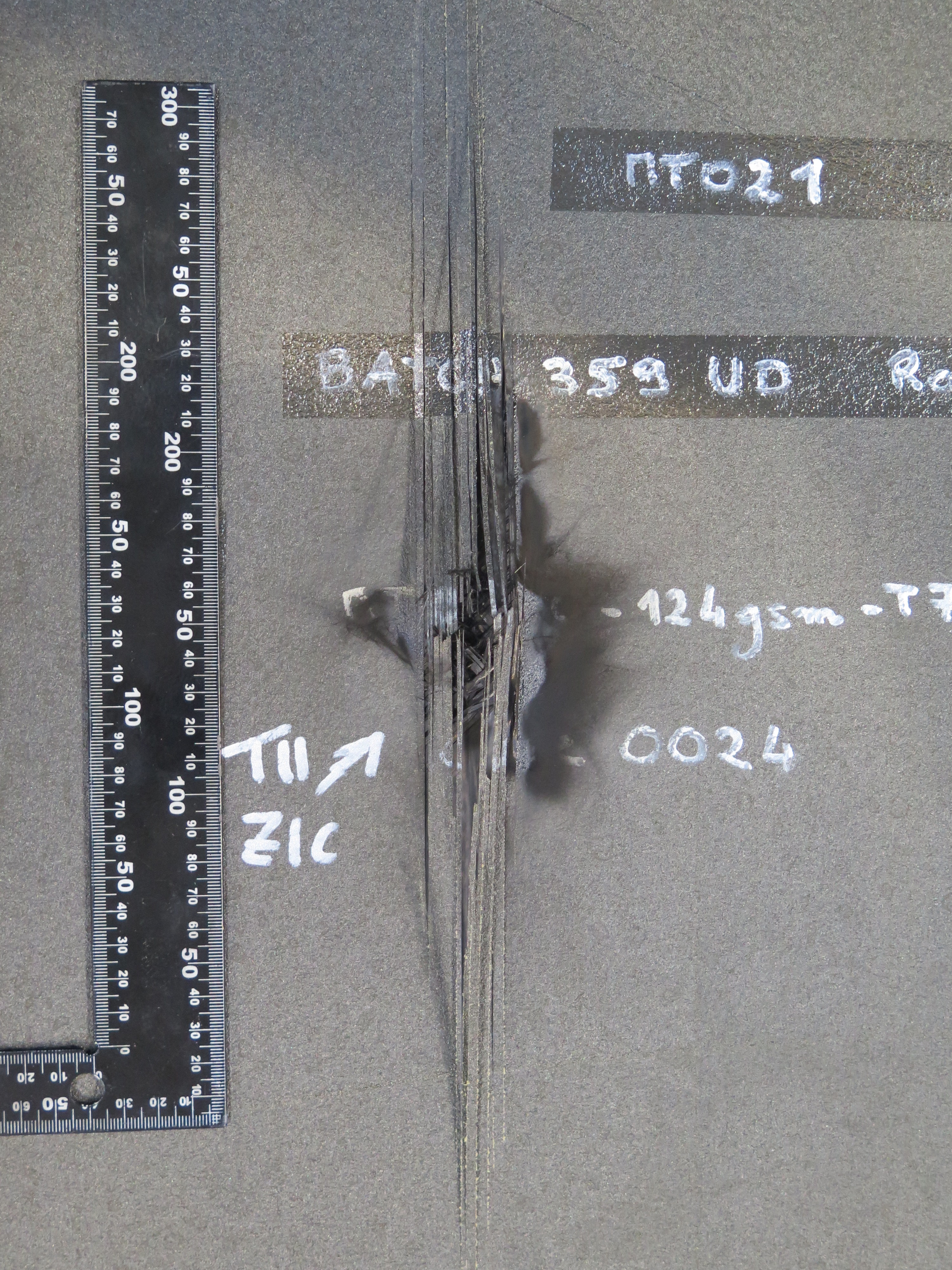 Figure 1. Back face of unmodified panel after lightning strike showing punch-through.