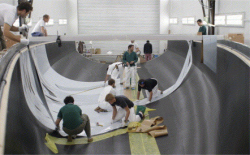 Laying initial layers of outer skin prepreg into the hull mould. (Picture courtesy of Killian Bushe and Andrew Lowe.)